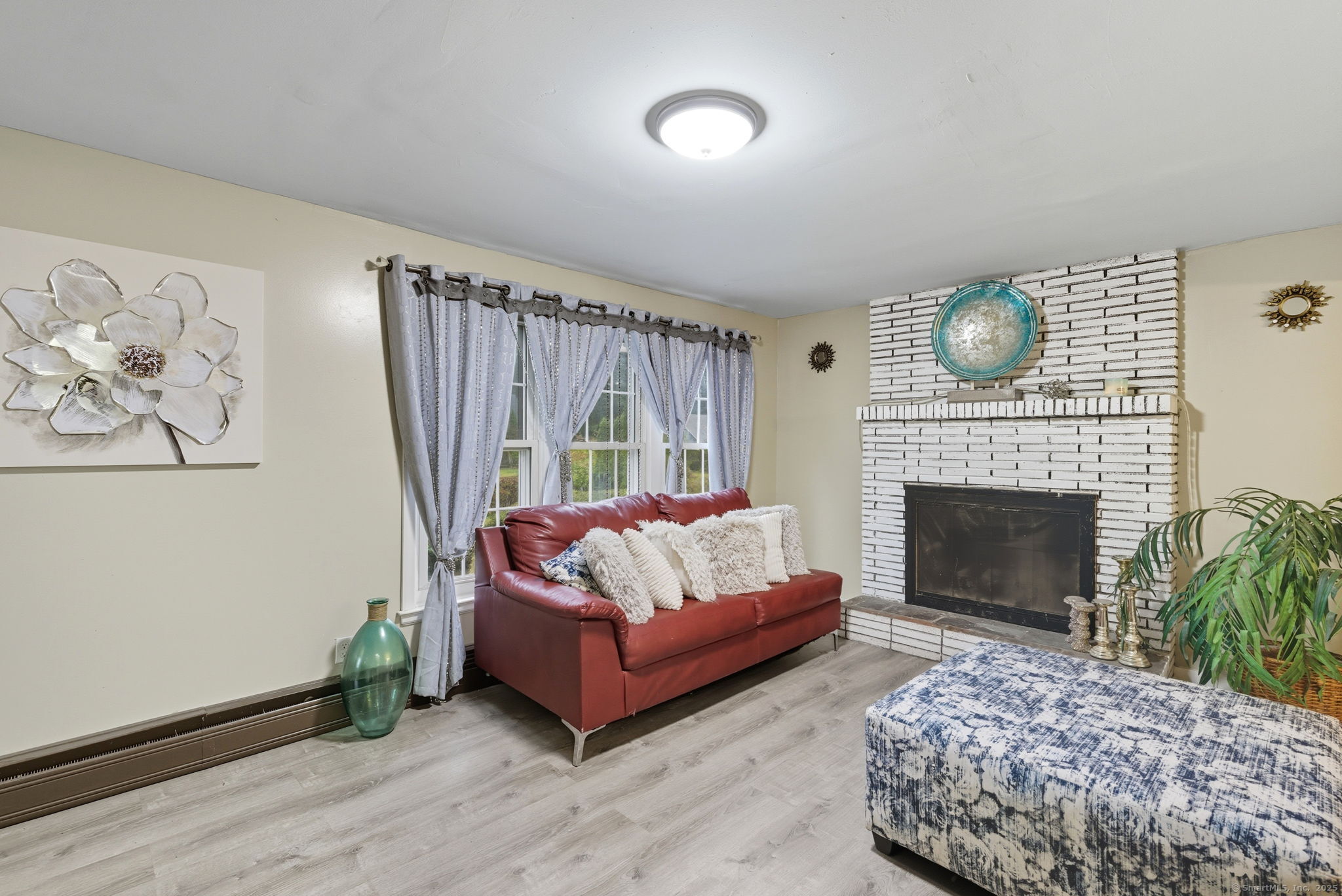 41 Chestnut Drive Windsor, CT 06095 - Photo 4 of 27 a living room with furniture and a fireplace