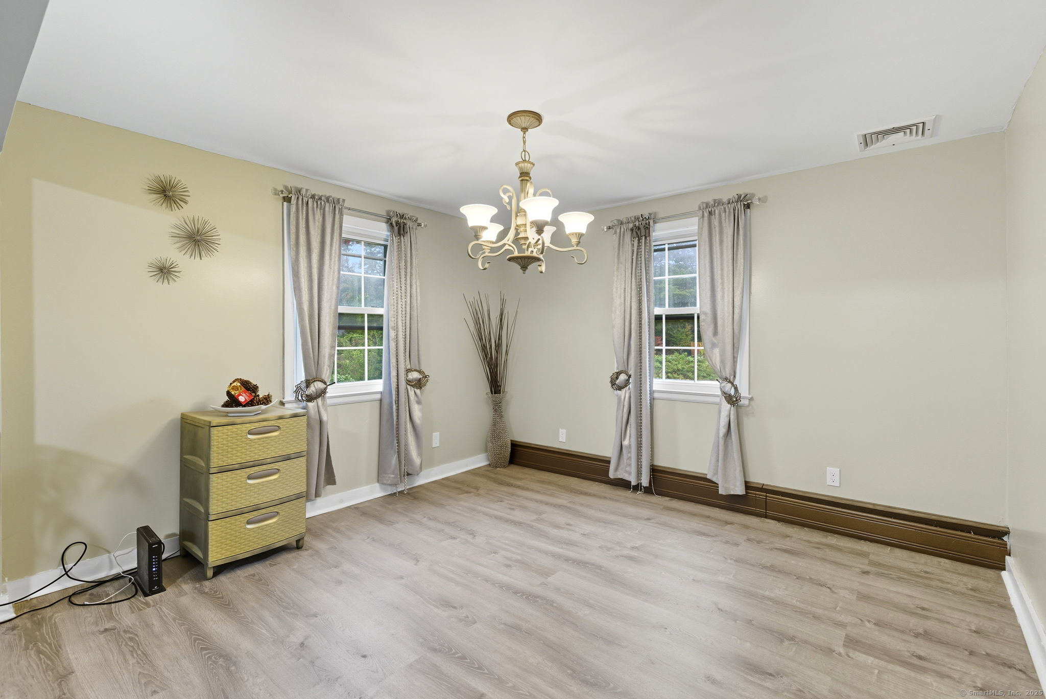 41 Chestnut Drive Windsor, CT 06095 - Photo 6 of 27 wooden floor in an empty room with a window