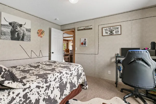 a bathroom with a sink toilet and mirror