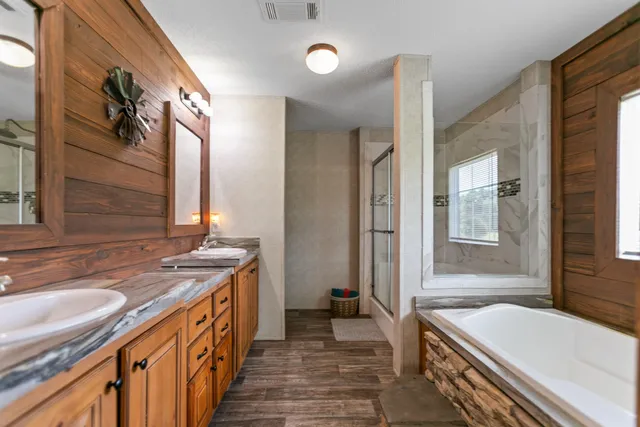 a view of a big yard with large trees