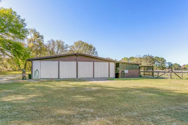 a view of a swimming pool with a table and chairs