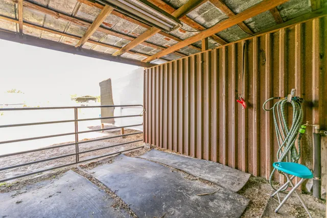 a view of a porch with wooden floor