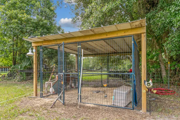 a view of balcony with wooden floor and fence