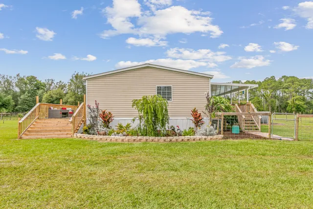 an aerial view of a house with swimming pool
