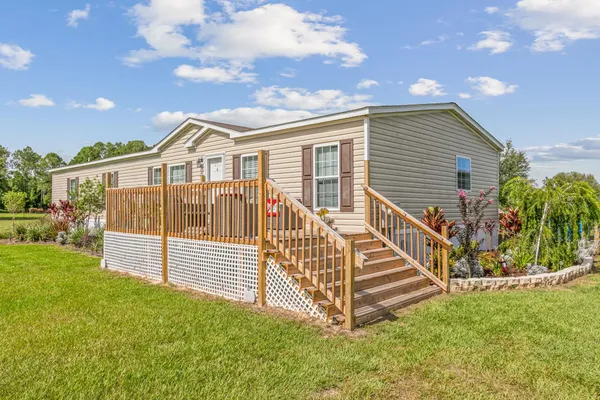 a bed room with a bed and a chandelier