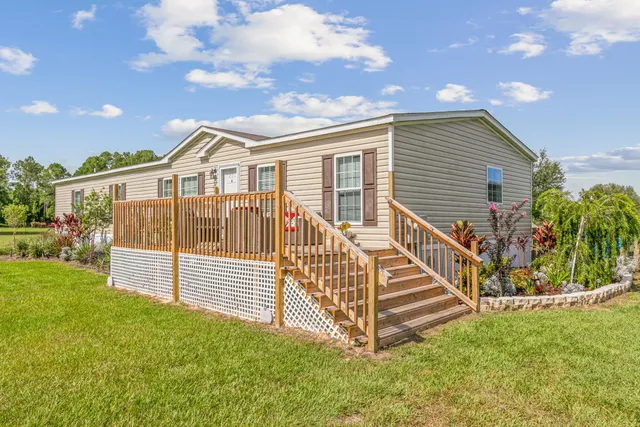 a bed room with a bed and a chandelier