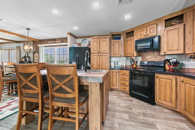 a kitchen with a table and chairs