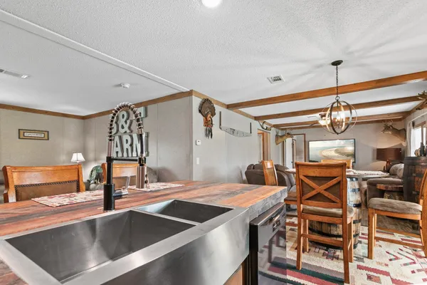 a living room with furniture a window and a ceiling fan