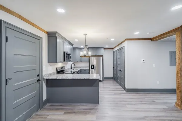 a view of living room with granite countertop furniture and fireplace
