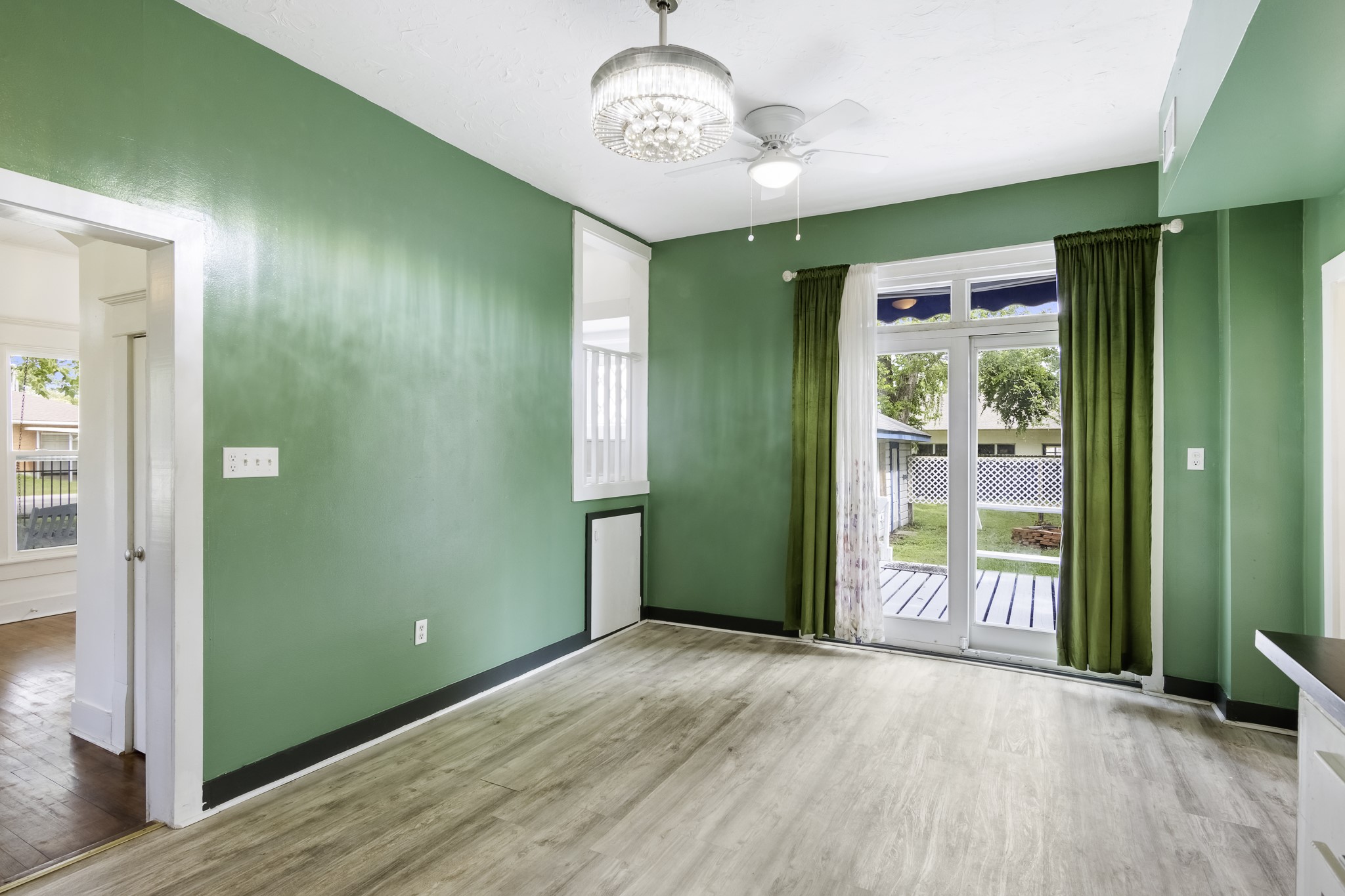 1200 4th Street Palacios, TX 77465 - Photo 11 of 44 a view of a room with a large window and wooden floor