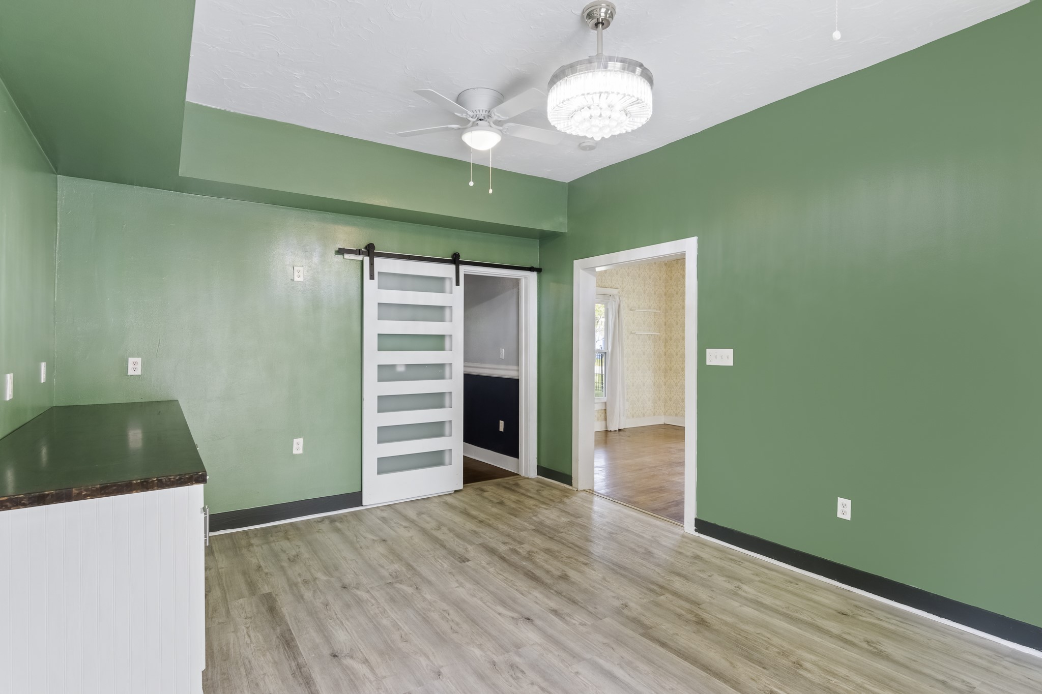1200 4th Street Palacios, TX 77465 - Photo 12 of 44 wooden floor in an empty room with a window