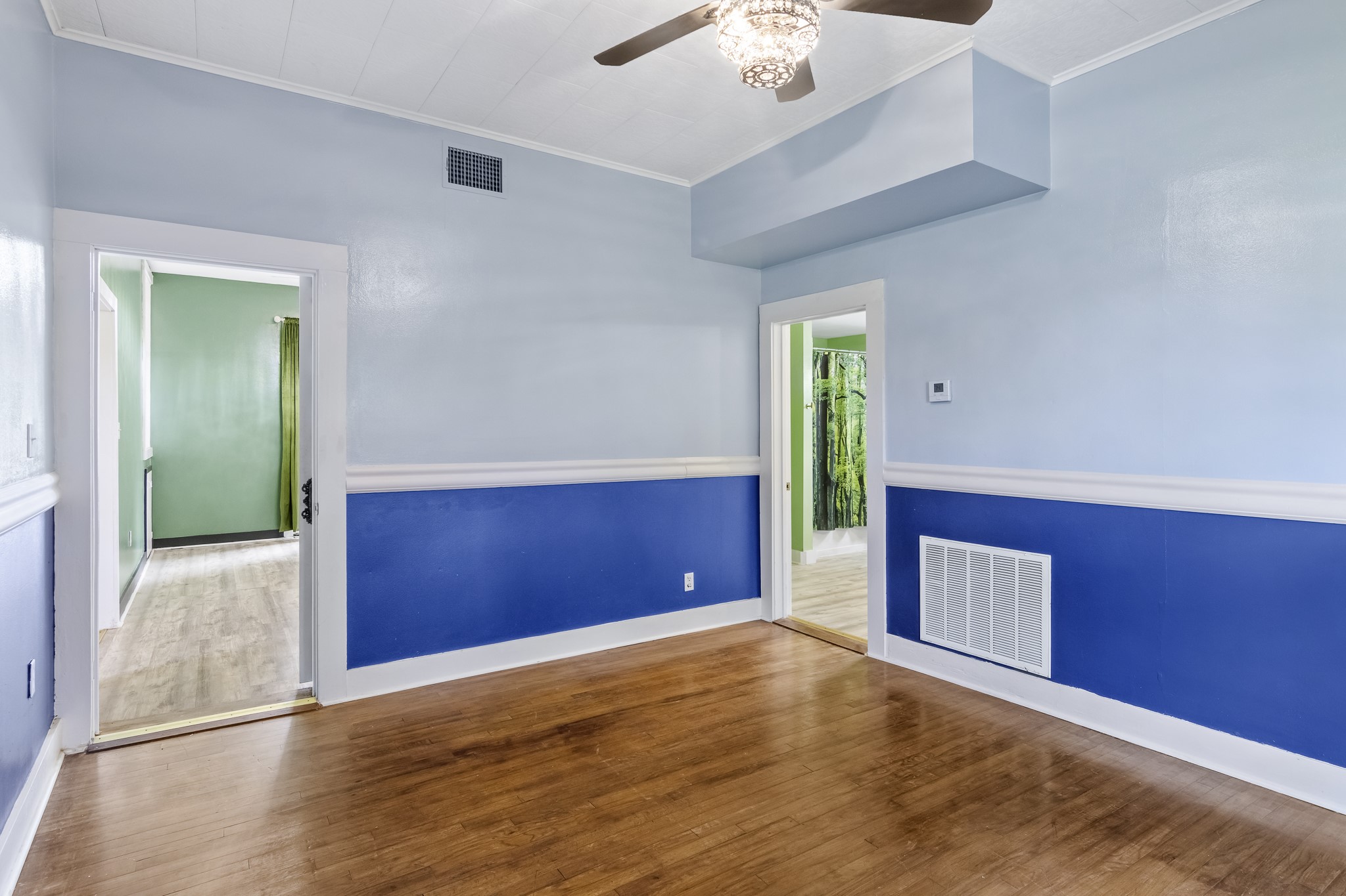 1200 4th Street Palacios, TX 77465 - Photo 18 of 44 a view of empty room with window and wooden floor