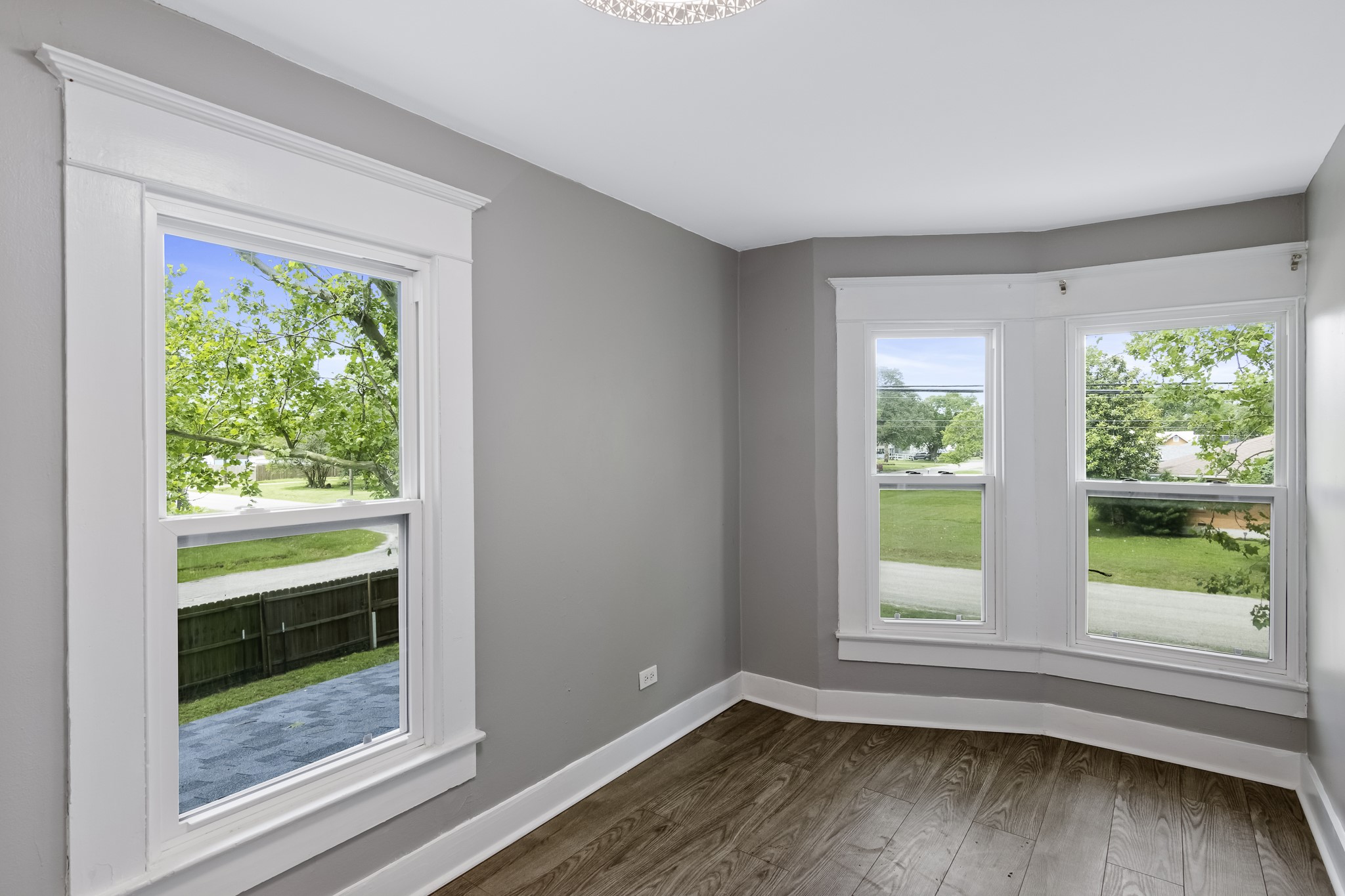 1200 4th Street Palacios, TX 77465 - Photo 33 of 44 a view of an empty room with wooden floor and a window