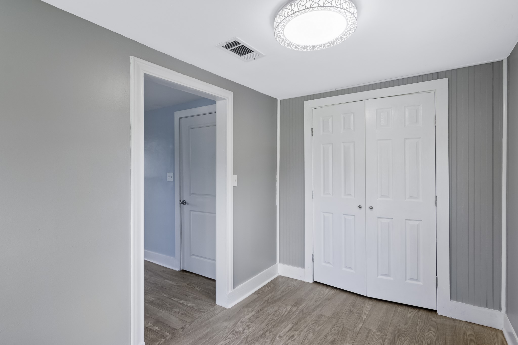 1200 4th Street Palacios, TX 77465 - Photo 34 of 44 an empty room with wooden floor and windows