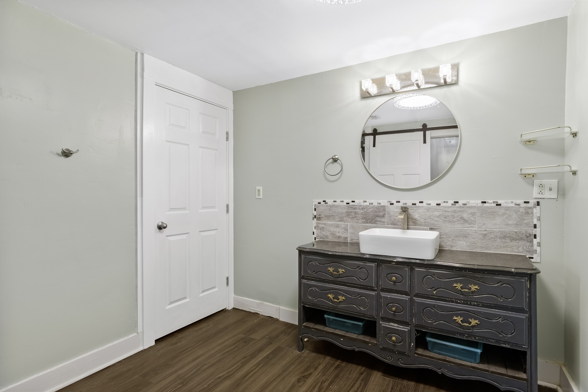 1200 4th Street Palacios, TX 77465 - Photo 35 of 44 a bathroom with a granite countertop double vanity sink and a mirror