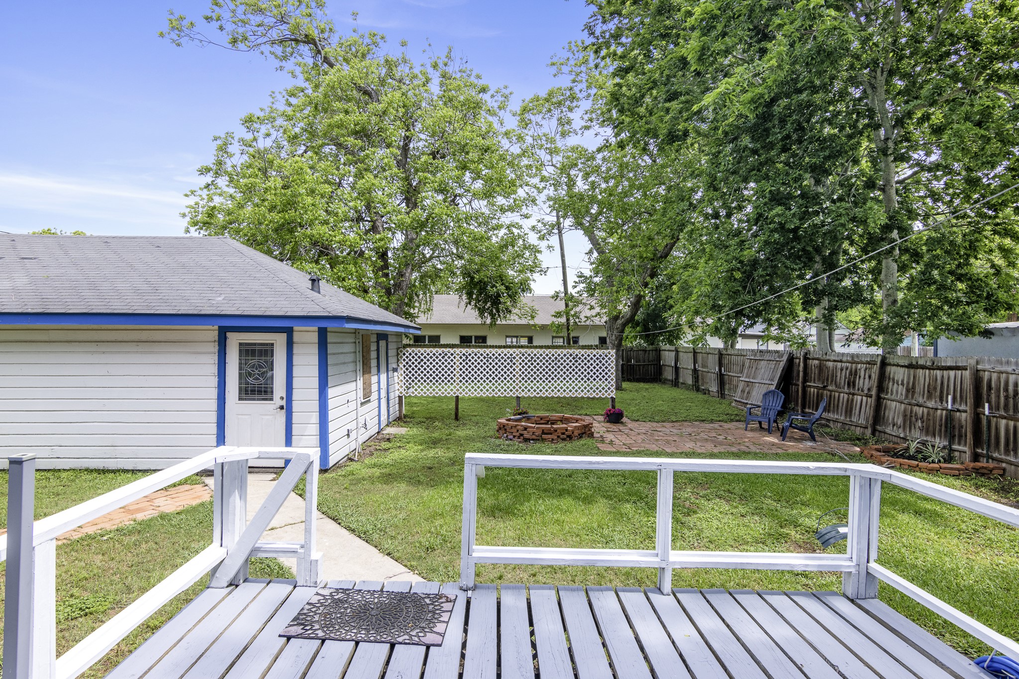 1200 4th Street Palacios, TX 77465 - Photo 38 of 44 a view of a wooden deck and a yard