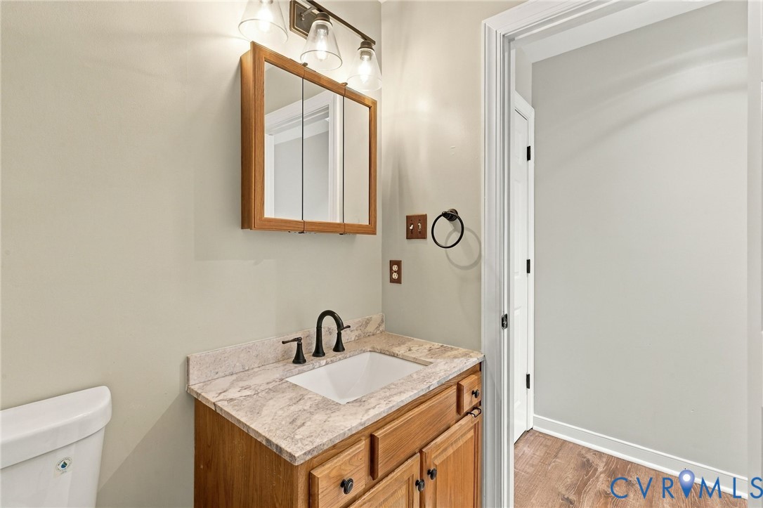 133 Ford Road Bumpass, VA 23024 - Photo 29 of 55 Wood-finish vanity with a light-toned countertop,