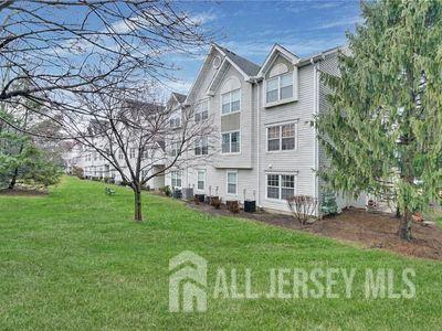 31 Edinburgh Court Edison, NJ 08820 - Photo 5 of 25 a front view of a house with a yard
