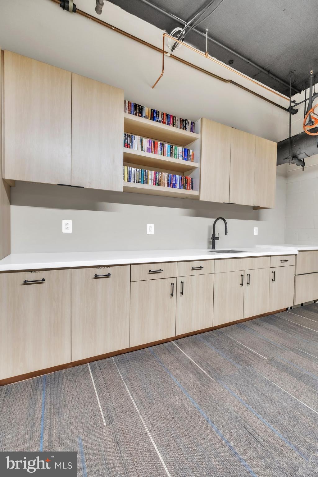 1801 Market Street, Unit 1817 Philadelphia, PA 19103 - Photo 19 of 77 a view of a kitchen with cabinets and wooden floor