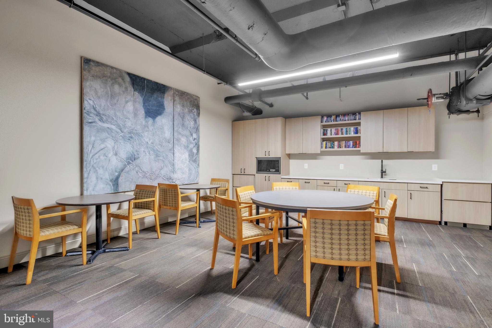 1801 Market Street, Unit 1817 Philadelphia, PA 19103 - Photo 22 of 77 a dining room with a wooden table and chairs