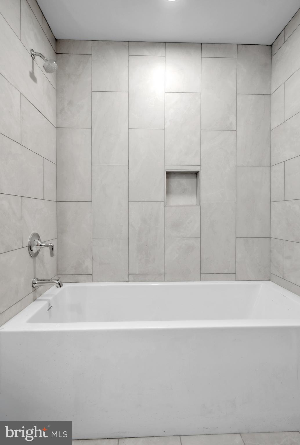 1801 Market Street, Unit 1817 Philadelphia, PA 19103 - Photo 8 of 77 a bathroom with a bathtub and shower