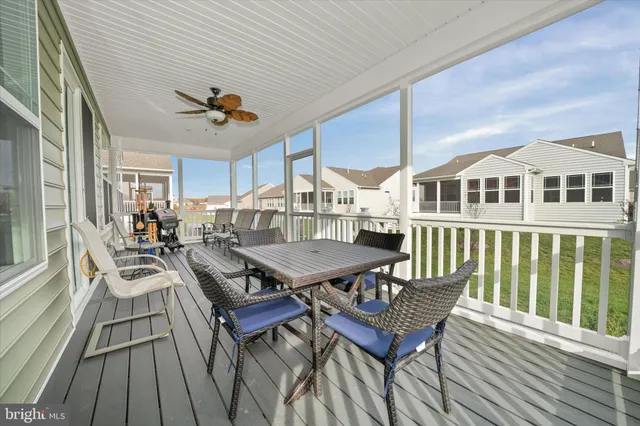 a view of a tennis ground with large trees
