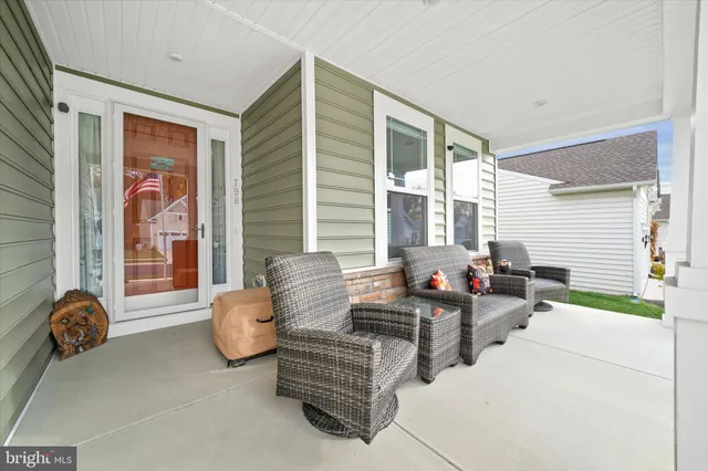 a dining room with furniture window and wooden floor