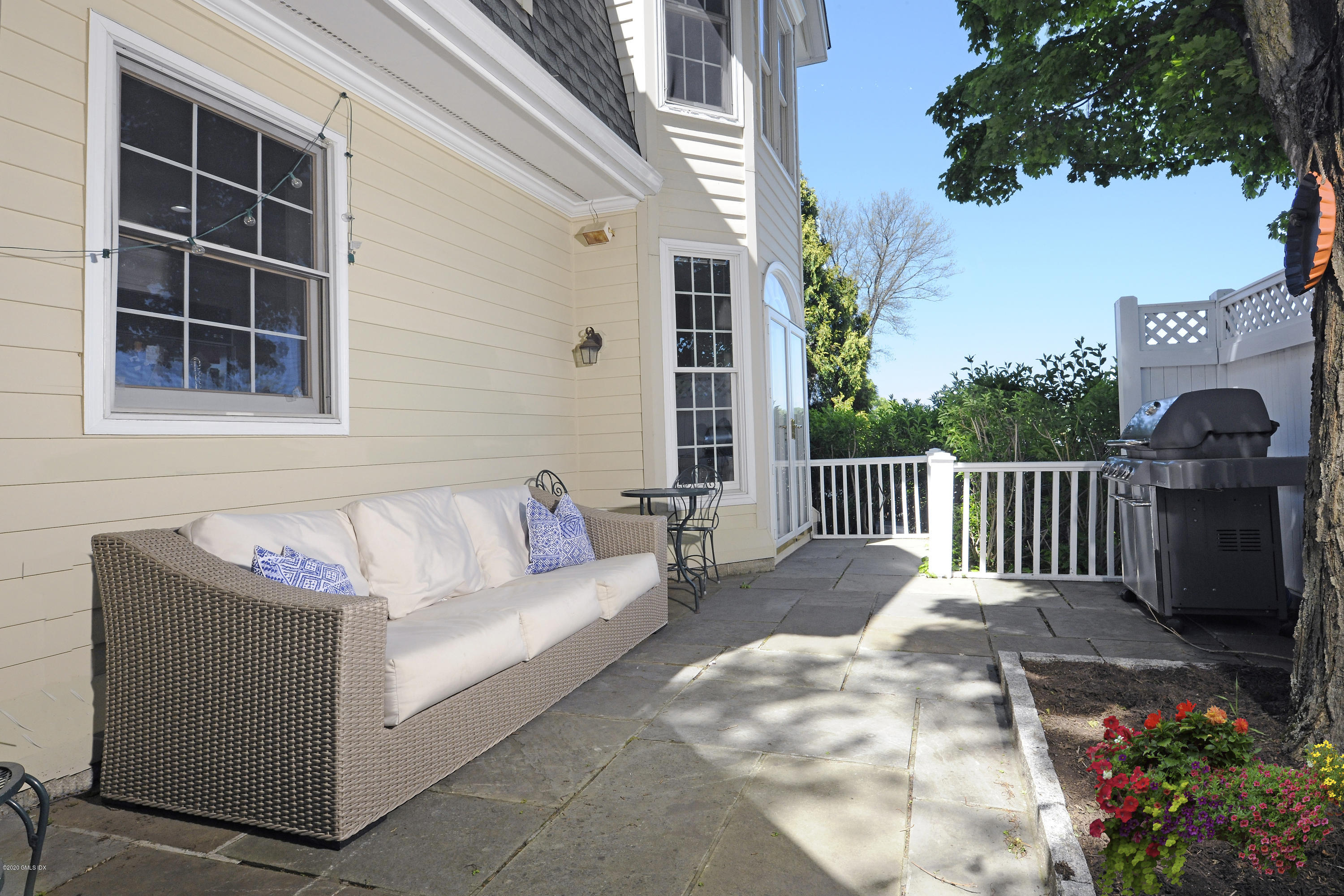 48 Spring Street, Unit 10 Greenwich, CT 06830 - Photo 11 of 11 a view of a deck with couches and potted plants