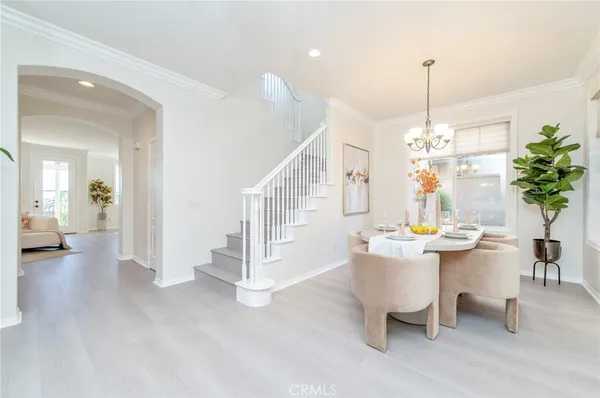 a view of a living room and entryway