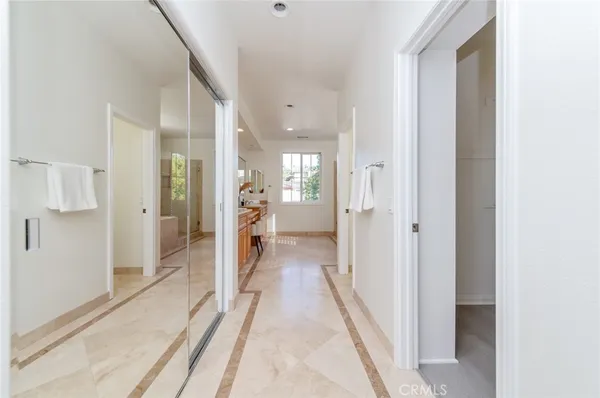 a large bathroom with double vanity and a mirror