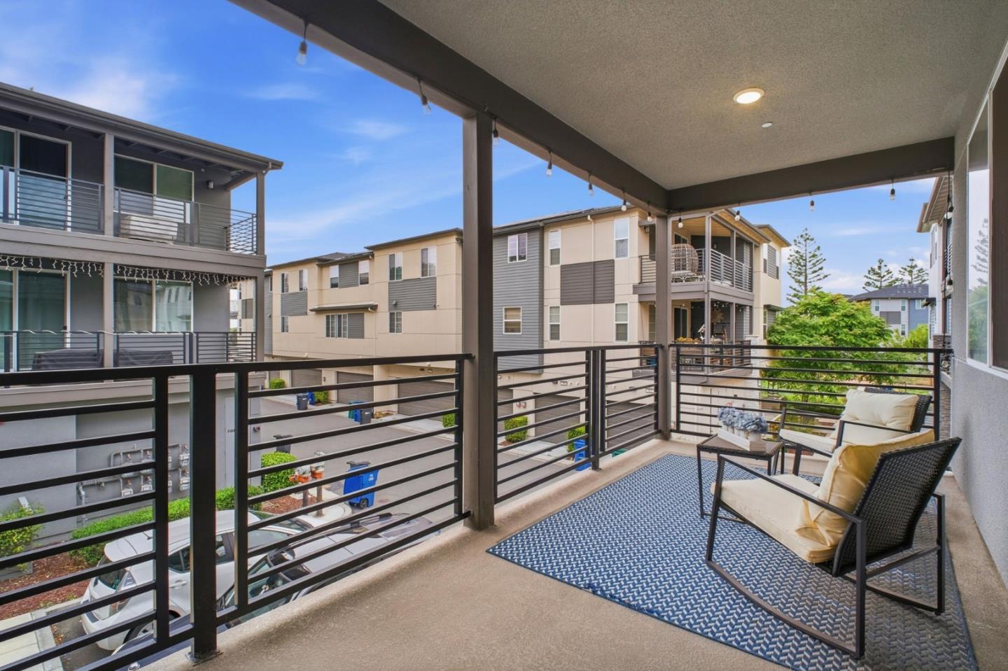 385 Line Street Hayward, CA 94544 - Photo 30 of 38 a balcony with table and chairs