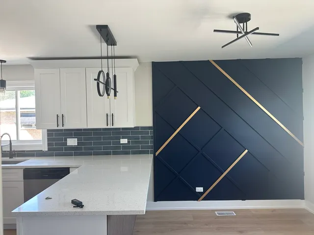 a kitchen with a sink a counter space and cabinets