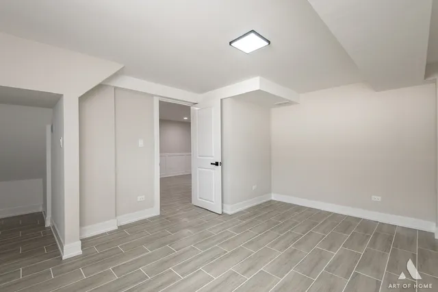 an entryway in a hallway with wooden floor