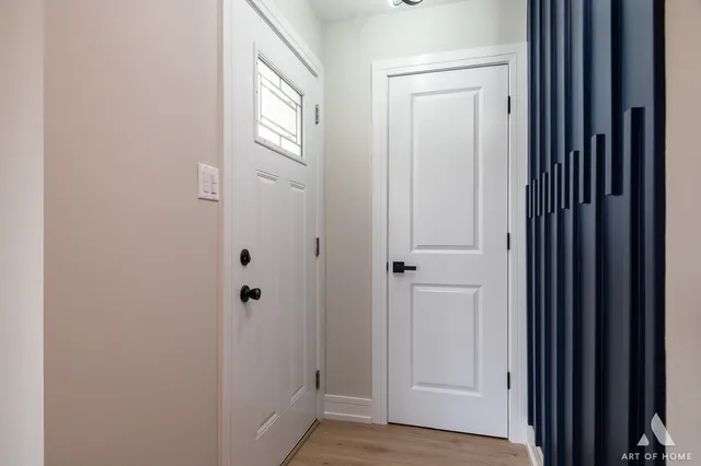 a view of a bathroom with wooden floor