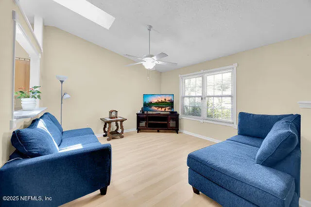 a room with a bed and a flat screen tv