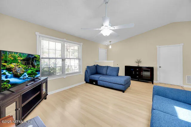 a kitchen with stainless steel appliances granite countertop a refrigerator a stove and a sink