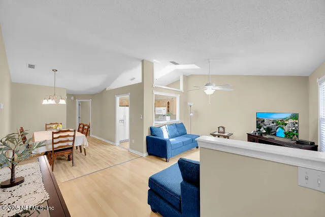 a kitchen with a sink cabinets and window