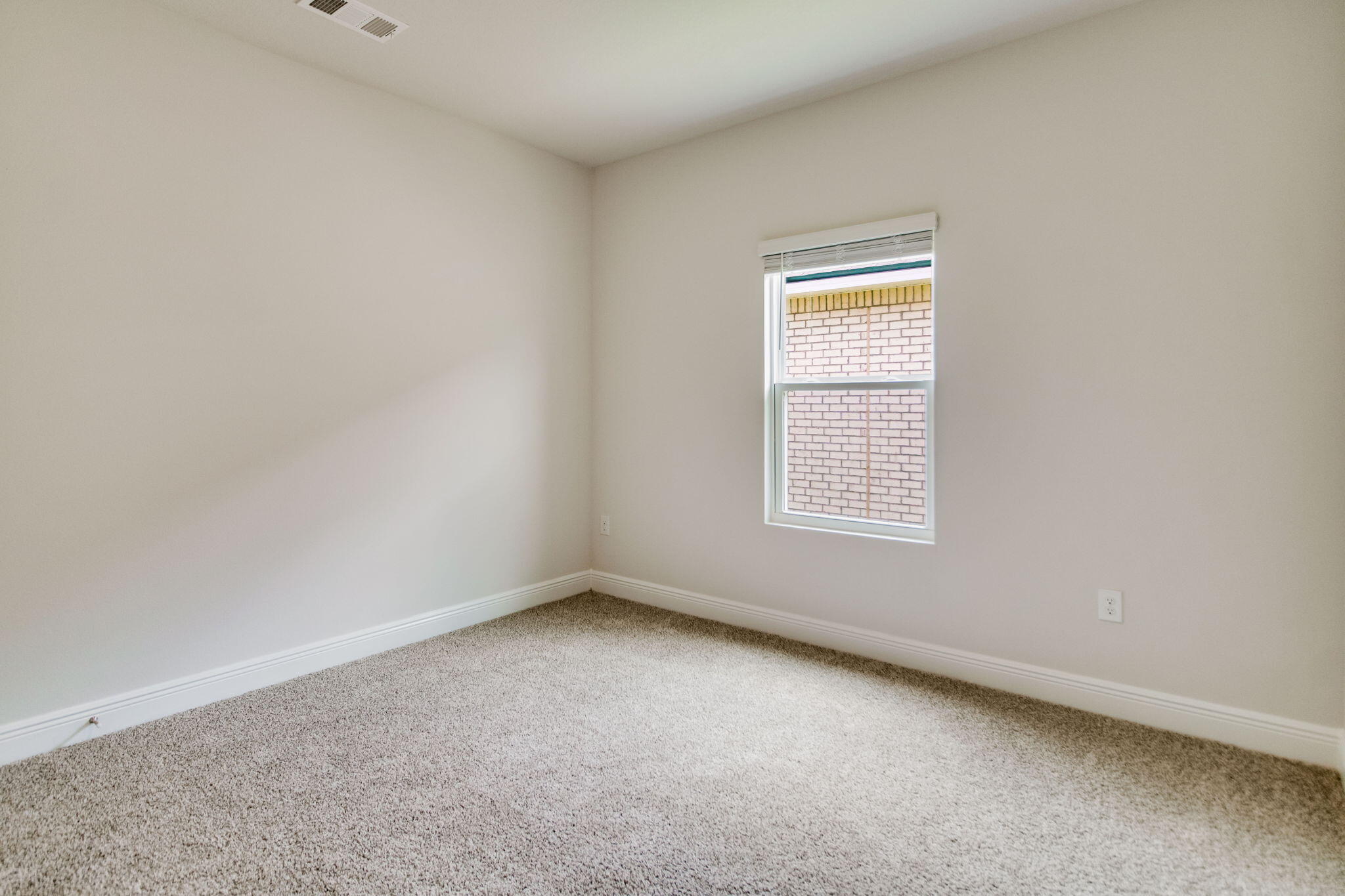8724 Bluebell Street Milton, FL 32583 - Photo 12 of 32 an empty room with a window