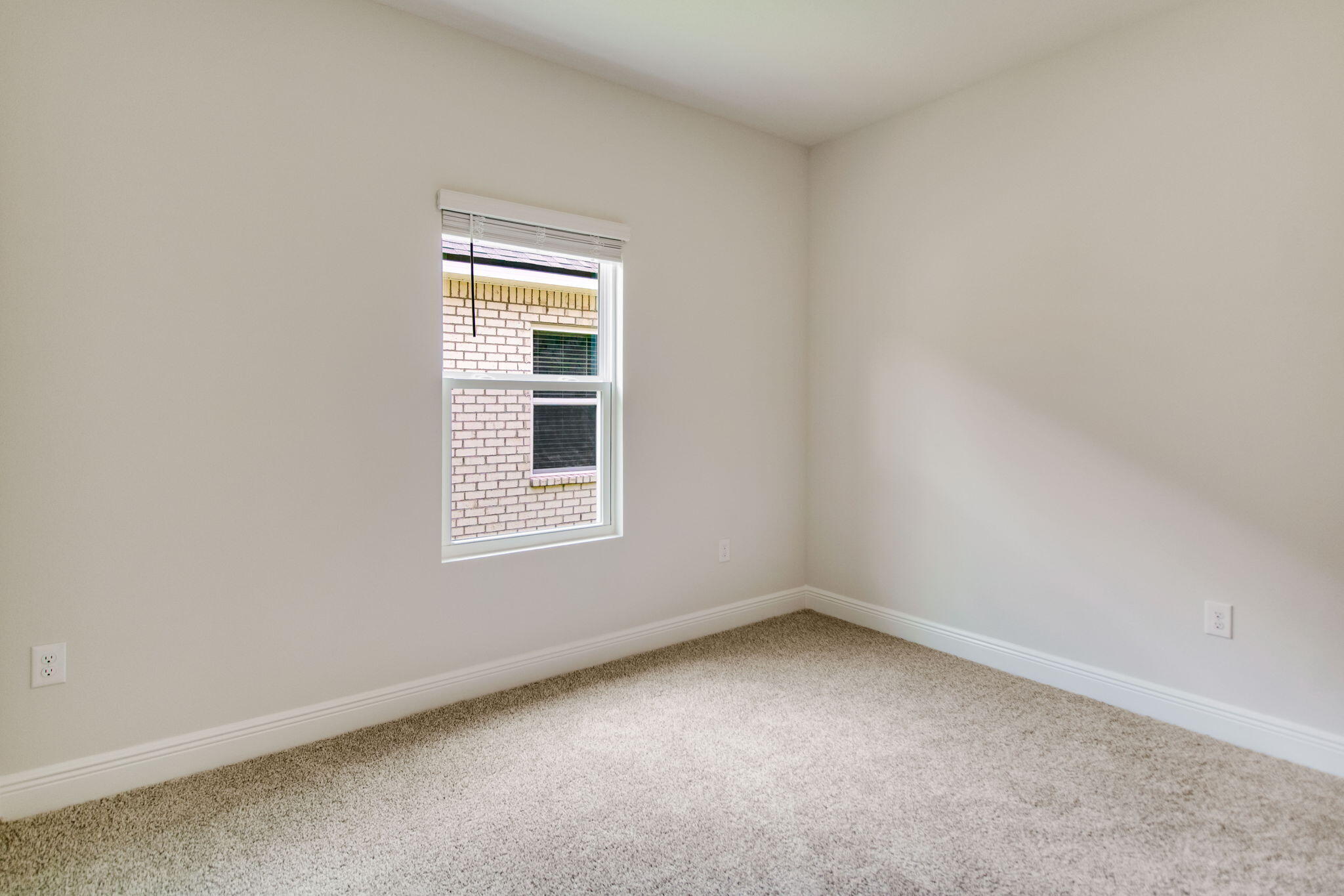 8724 Bluebell Street Milton, FL 32583 - Photo 25 of 32 an empty room with a window