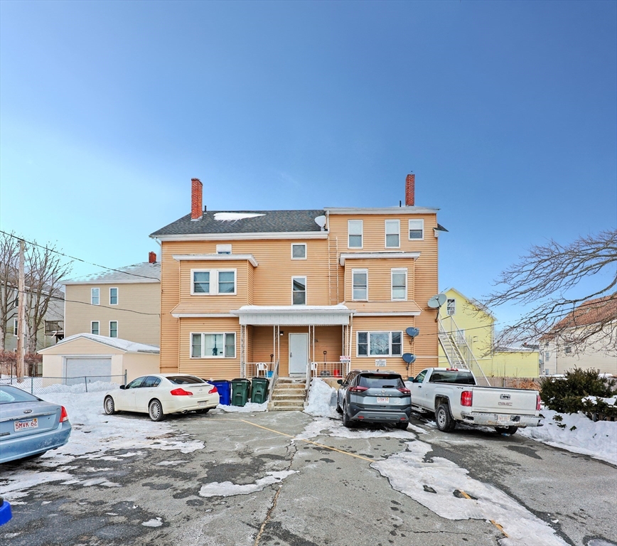 94 Snell Street Fall River, MA 02721 - Photo 1 of 15 a car parked in front of a building