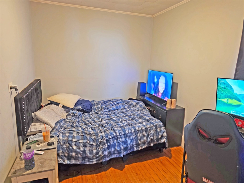 94 Snell Street Fall River, MA 02721 - Photo 11 of 15 a bedroom with a bed and dresser