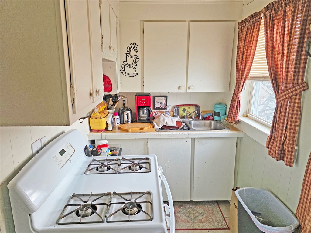 94 Snell Street Fall River, MA 02721 - Photo 15 of 15 a room with storage and utility