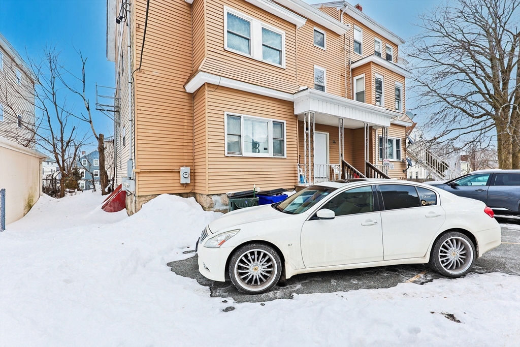 94 Snell Street Fall River, MA 02721 - Photo 4 of 15 a car parked in front of a house