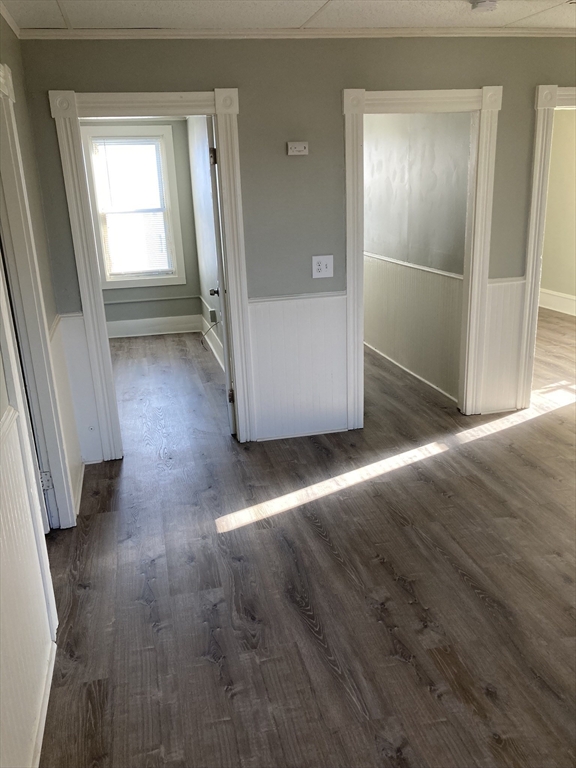 94 Snell Street Fall River, MA 02721 - Photo 7 of 15 an empty room with wooden floor and windows
