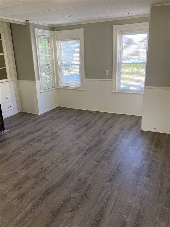 94 Snell Street Fall River, MA 02721 - Photo 9 of 15 an empty room with wooden floor and windows