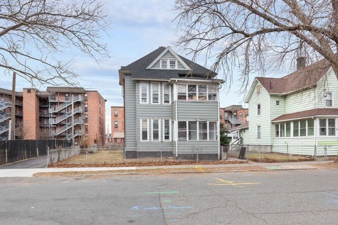 24 Adams Street Springfield, MA 01105 - Photo 1 of 12 front view of a house with a street