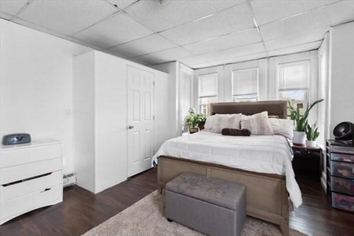 24 Adams Street Springfield, MA 01105 - Photo 5 of 12 a bedroom with a bed and a window