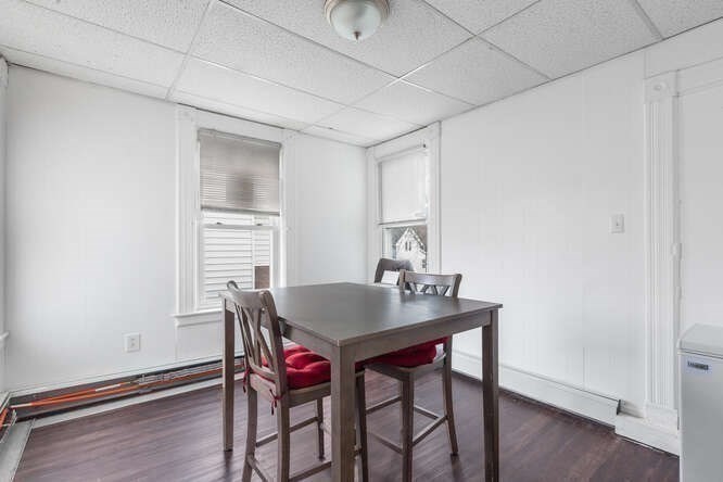 24 Adams Street Springfield, MA 01105 - Photo 10 of 12 a view of a dining room with furniture and wooden floor