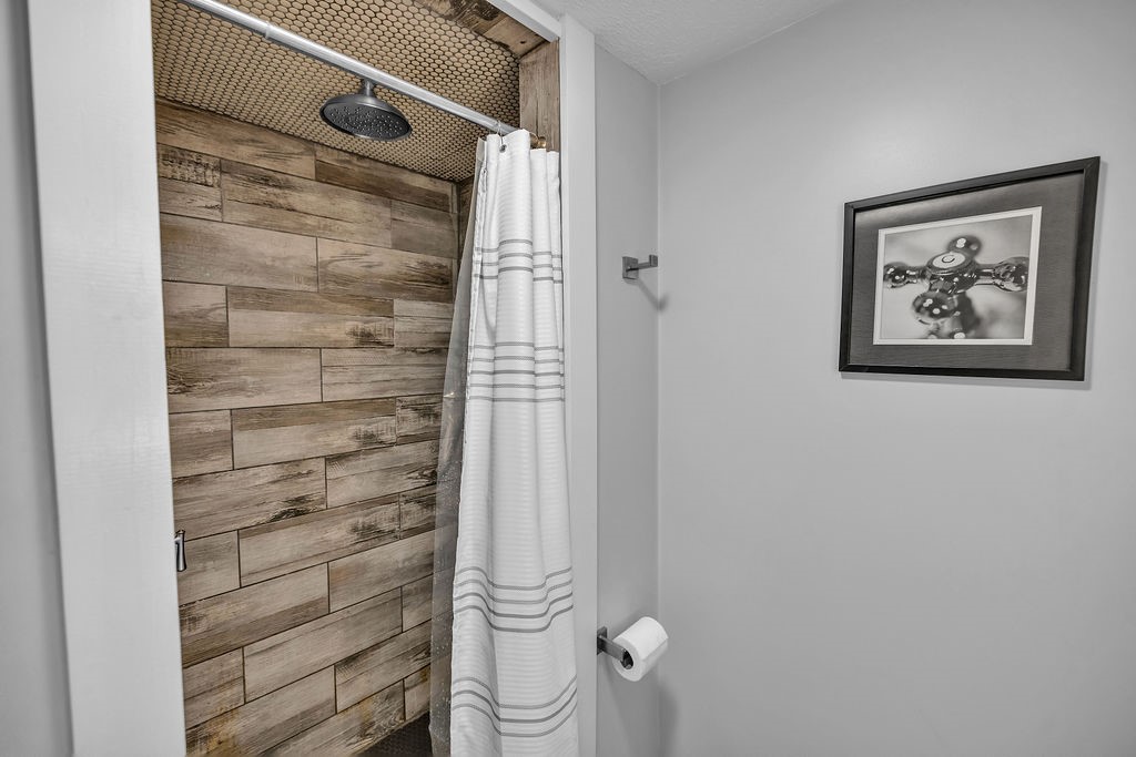 1937 Dagmar Place Decatur, IL 62521 - Photo 11 of 39 a bathroom with a shower and a toilet