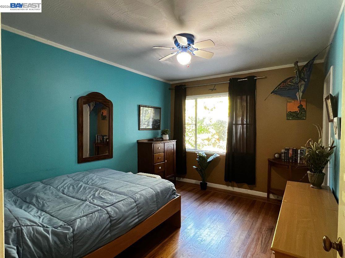 190 Alderwood Road Walnut Creek, CA 94598 - Photo 12 of 29 a bedroom with a bed and a chandelier